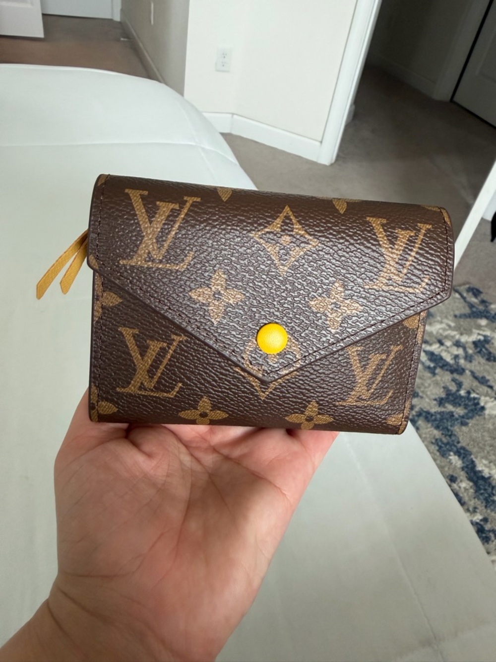 Brown monogram trifold wallet